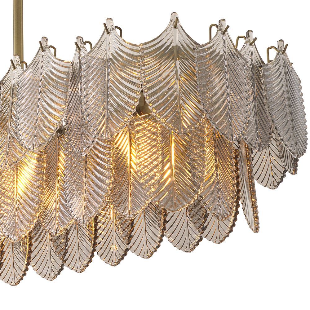 A beautiful chandelier by Eichholtz with a rectangular shape, brushed brass finish and smoke glass decorative leaf details