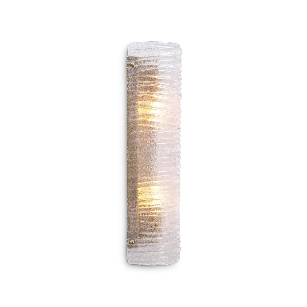 A gorgeous wall lamp by Eichholtz with a modern design and vintage brass finish with a ribbed clear glass shade