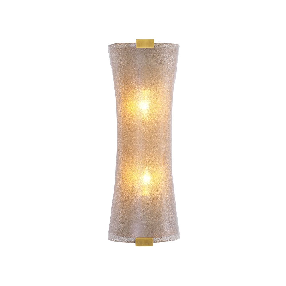 A unique wall lamp by Eichholtz with a hand blown glass curved shade and an antique brass finish