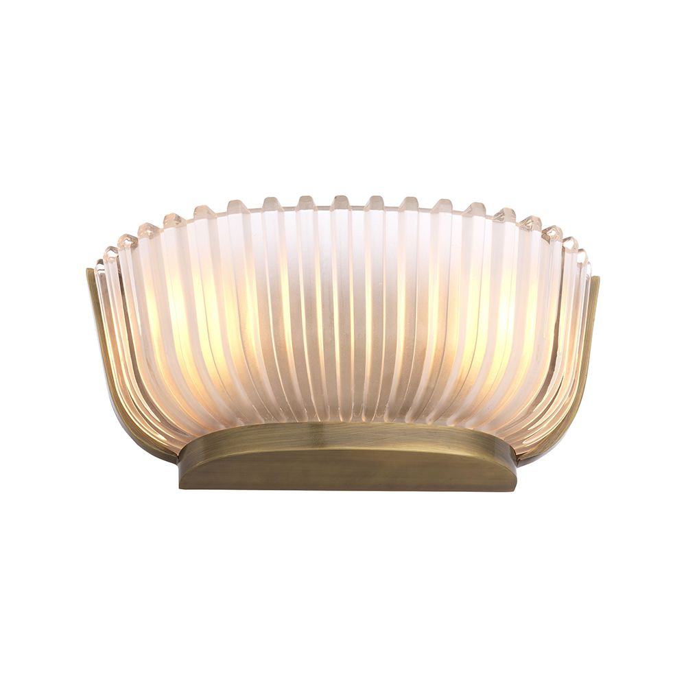 A luxurious wall lamp by Eichholtz featuring a frosted glass shade with vertical lines and a vintage brass finish