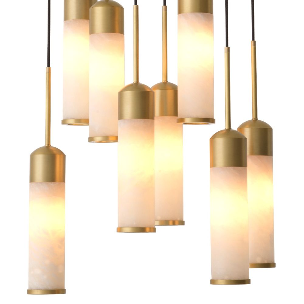 A luxury, statement chandelier by Eichholtz with a sculptural design and an antique brass finish 