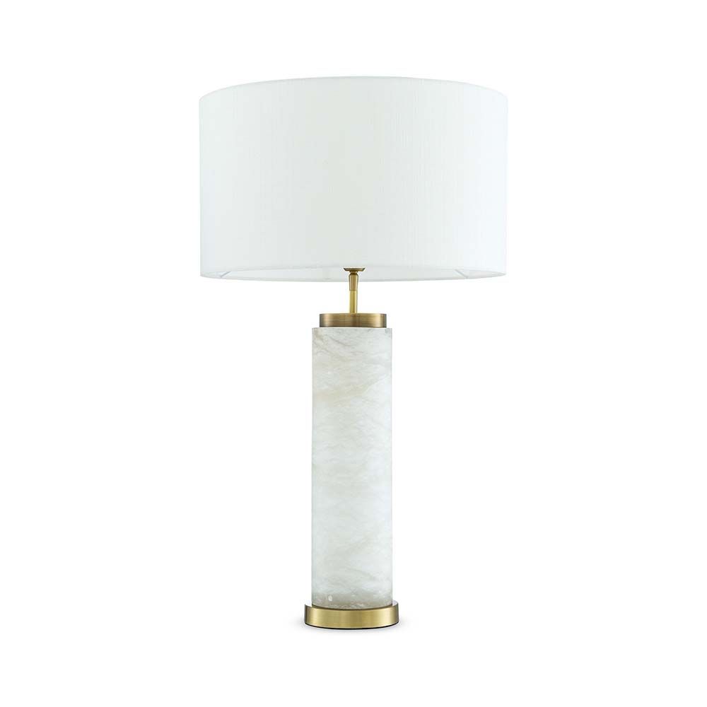 A gorgeous table lamp with brass accents and round shade