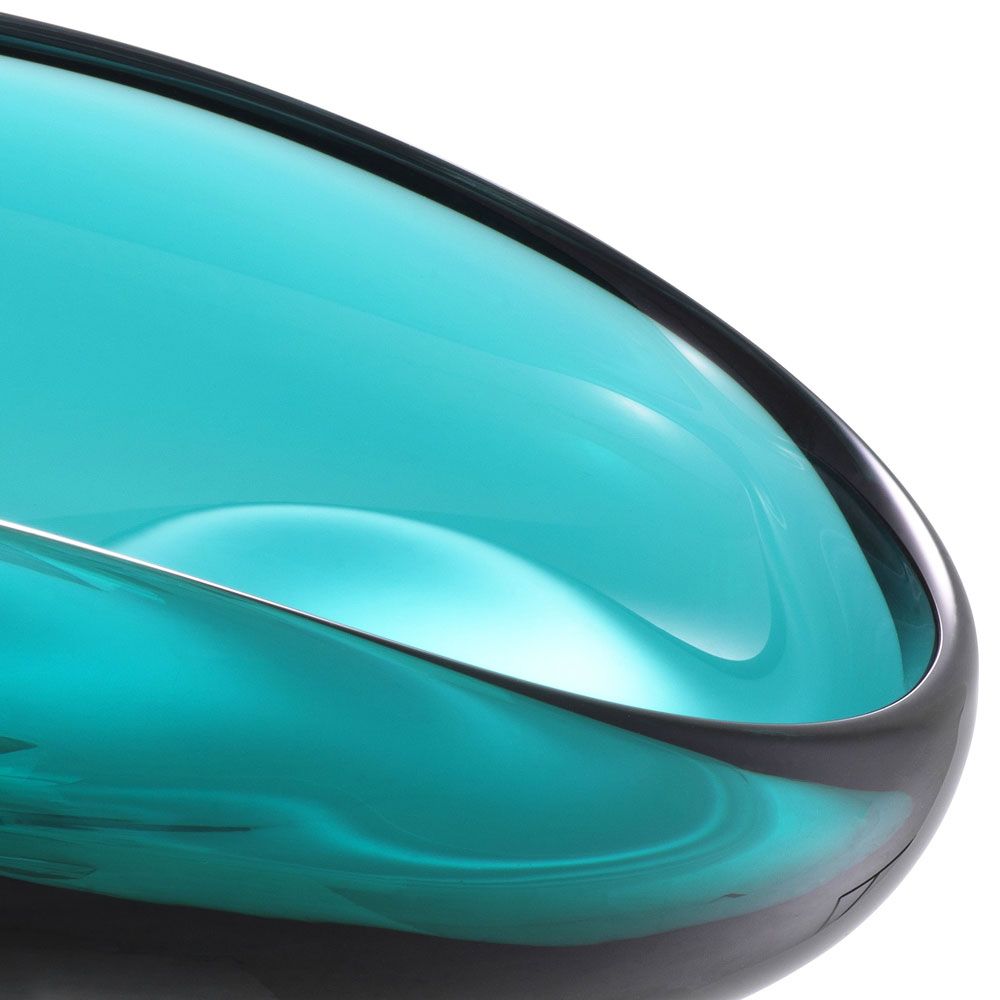 Elegant, flowing turquoise glass bowl