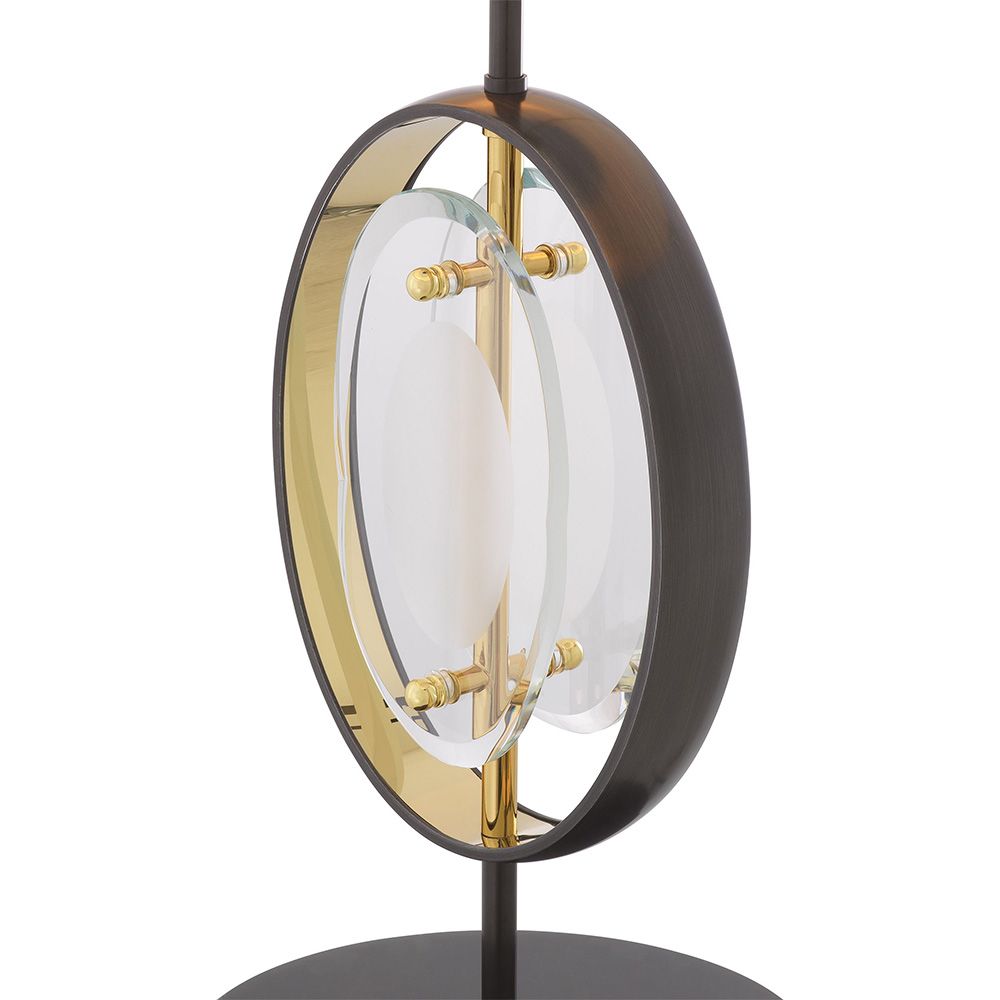 An elegant table lamp by Eichholtz with a honed marble base and gunmetal finish 