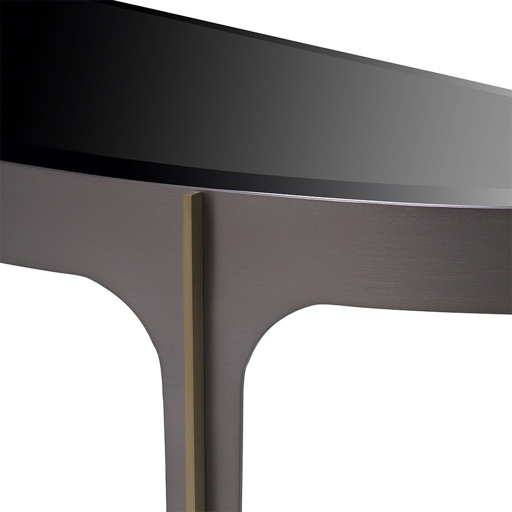 Opulent, bronze finish console table with sleek black glass top