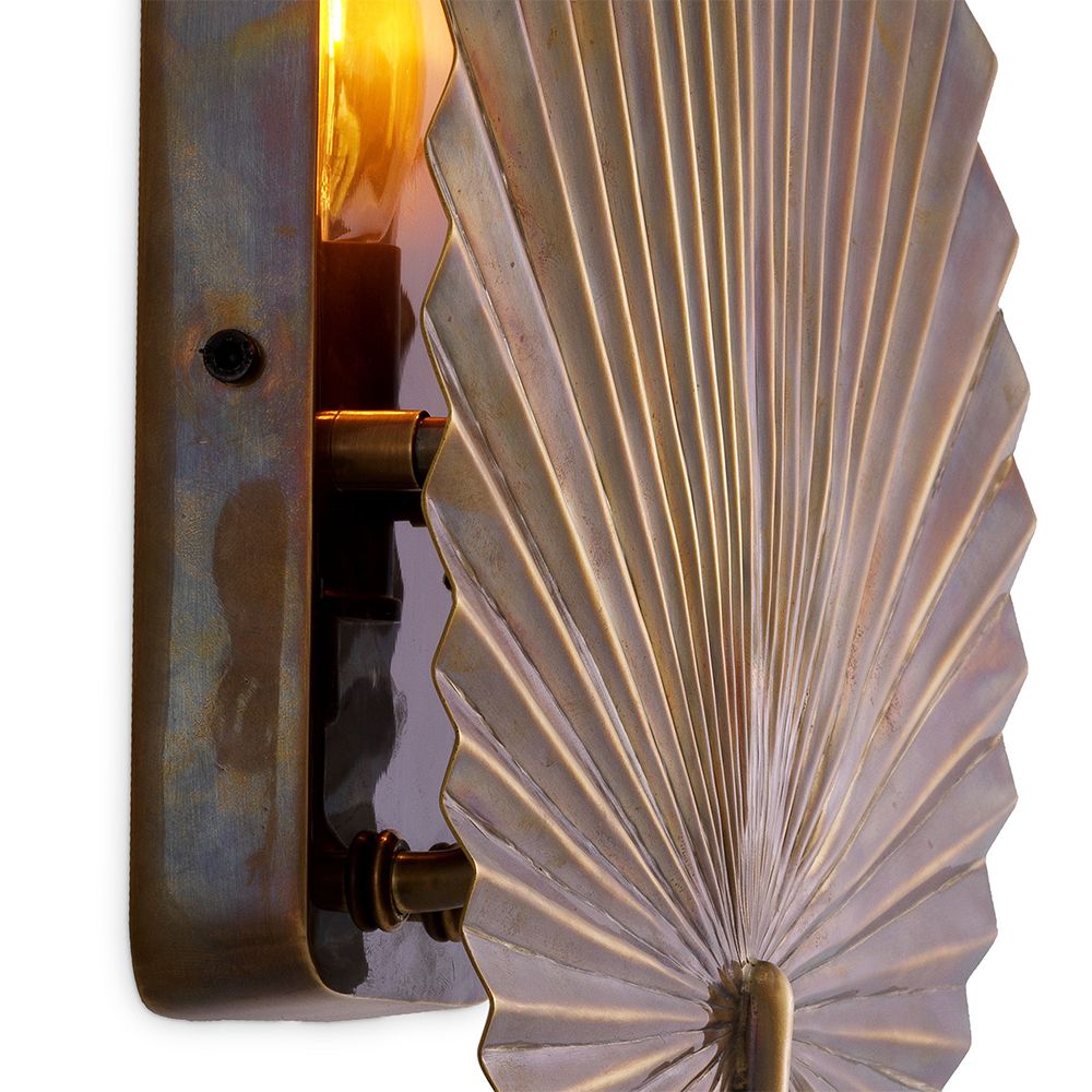 Tropical inspired fan wall light in brass finish