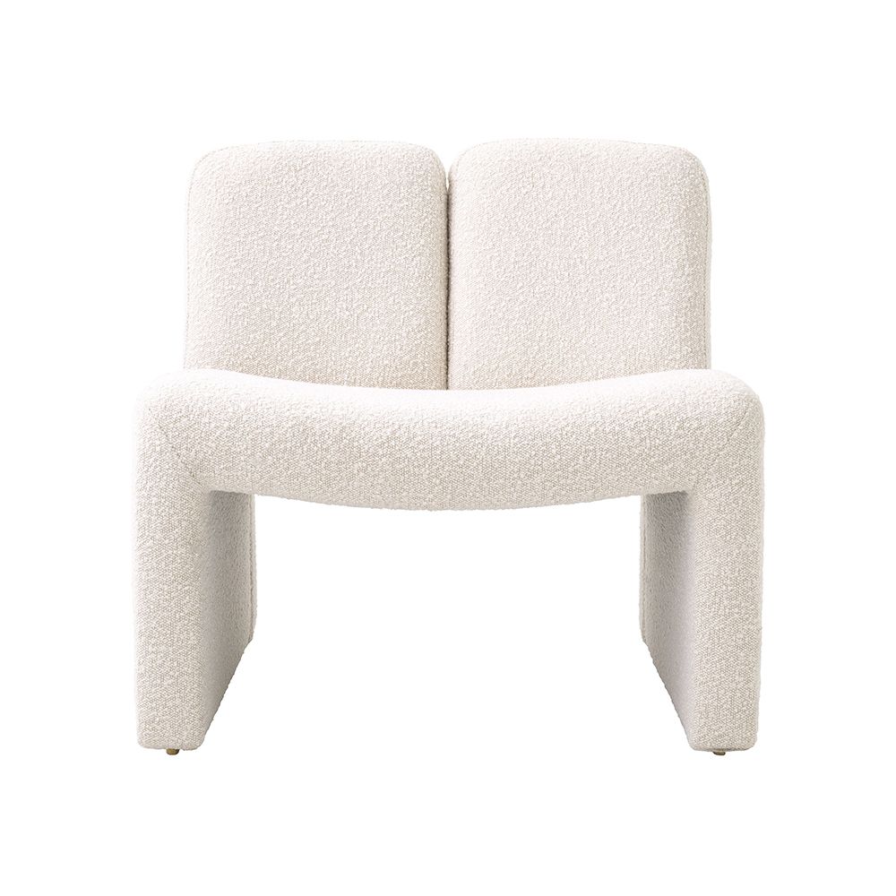 A contemporary modern chair by Eichholtz with a bouclé cream upholstery and original shape 