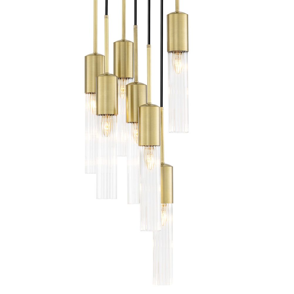 A stylish statement chandelier by Eichholtz with glamorous, cylindrical ribbed glass shades with an antique brass finish 
