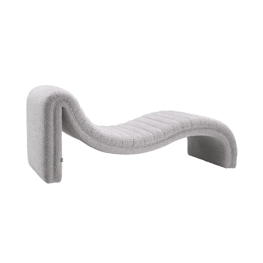 A contemporary chaise longue by Eichholtz with a curved design and beautiful bouclé grey upholstery