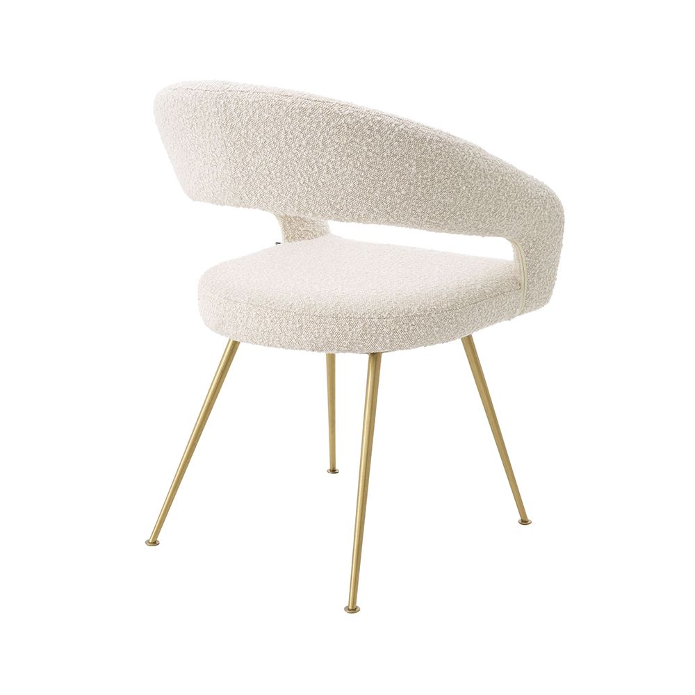A glamorous dining chair in a range of finishes with brass tapered legs