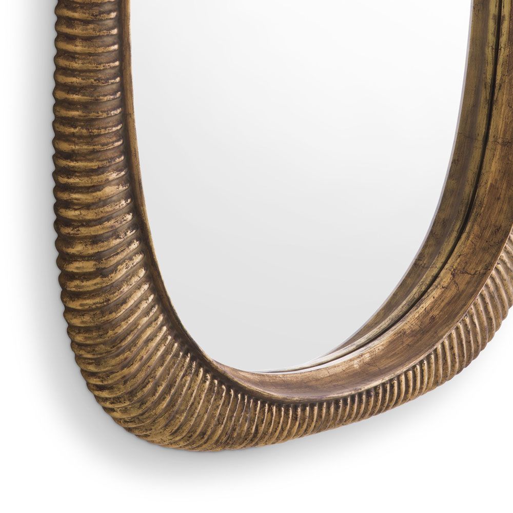 Glamorous wall mirror with antique brass ribbed frame