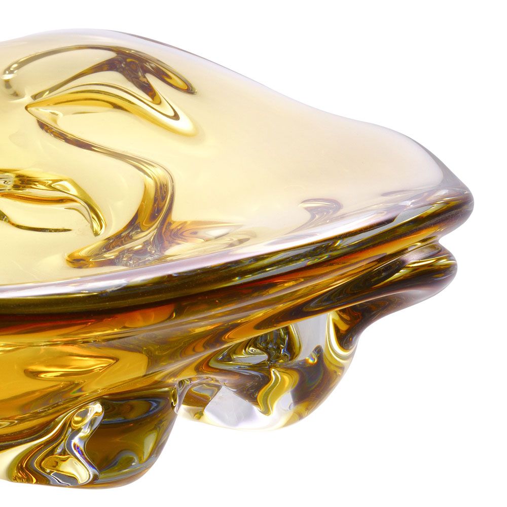Contemporary bowl featuring free-flowing shape crafted from yellow hand-blown glass