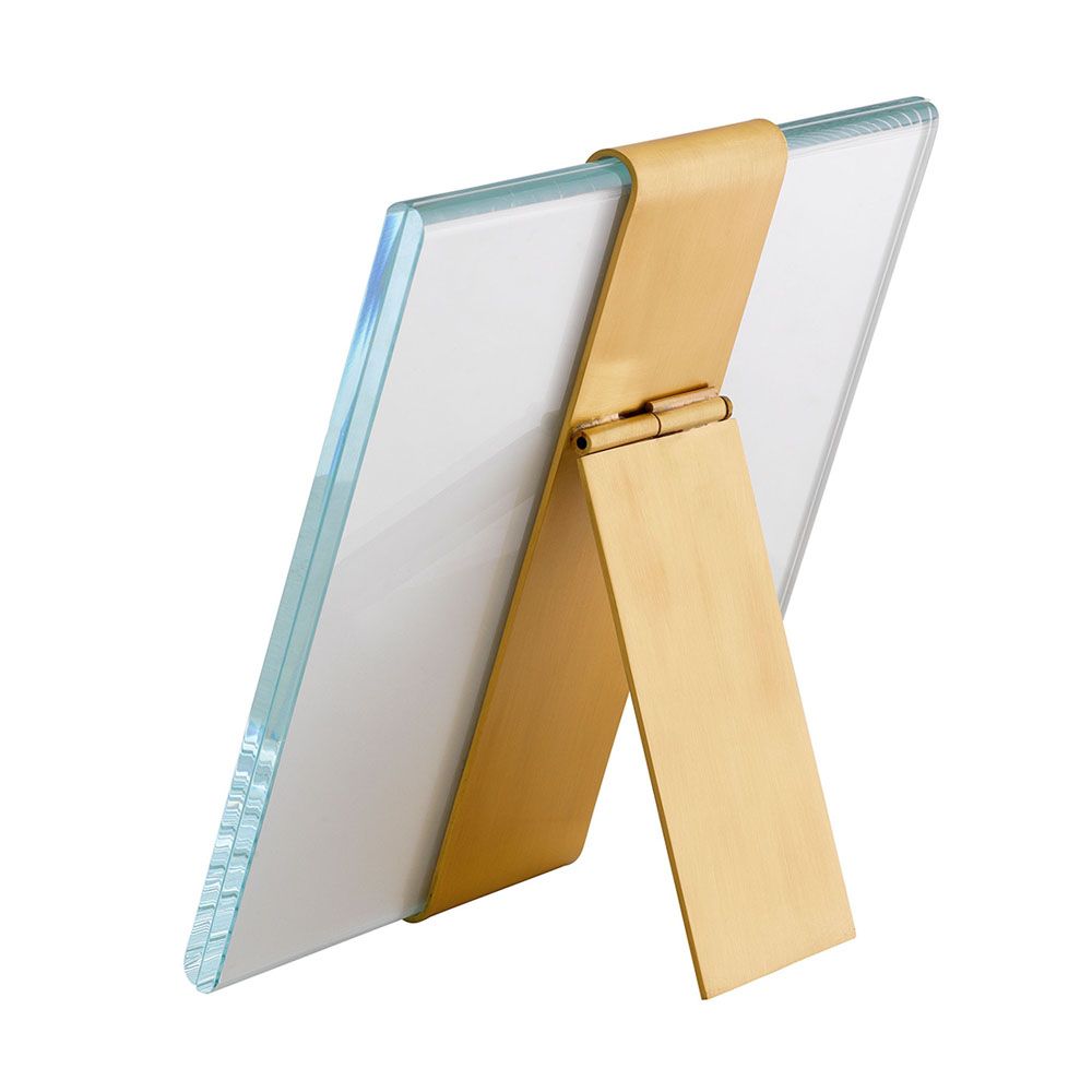 A glamorous, square picture frame by Eichholtz with brass detailing and a clear glass finish