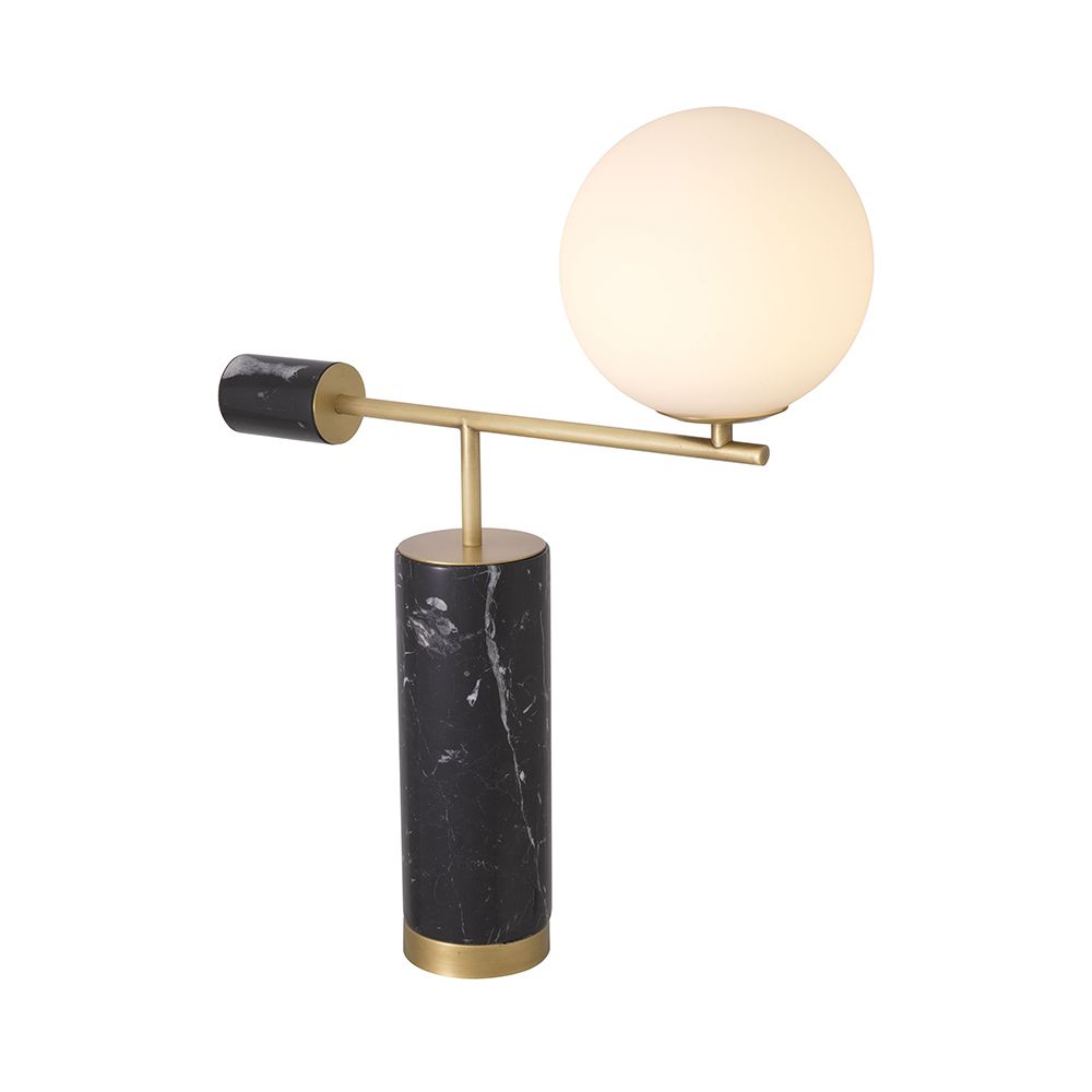 A striking, sculptural side lamp by Eichholtz crafted from black marble and finished with a spherical white glass shade and antique brass details