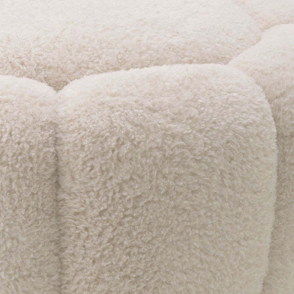 Cosy and stylish ottoman with brushed brass base