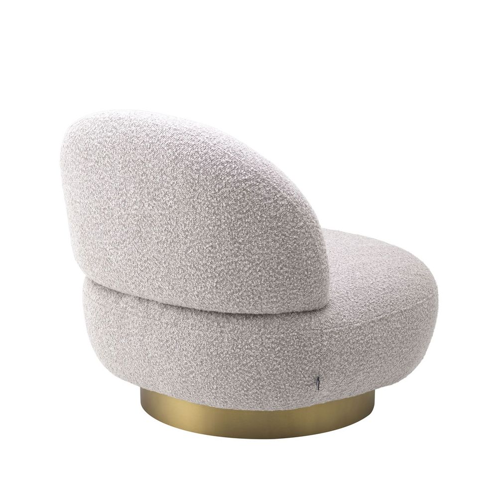Curvaceous grey boucle swivel chair with brushed brass base