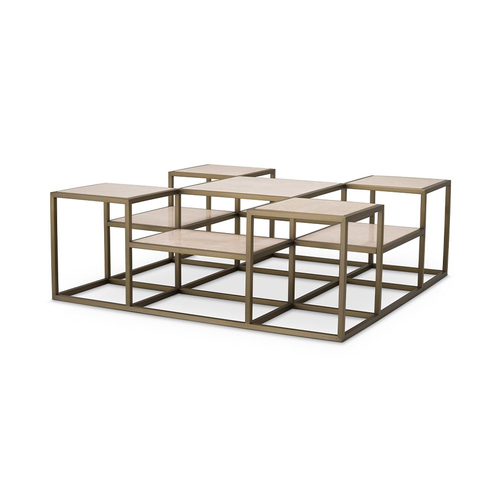 A contemporary coffee table by Eichholtz with a sculptural design featuring a brushed brass finish and travertine table tops