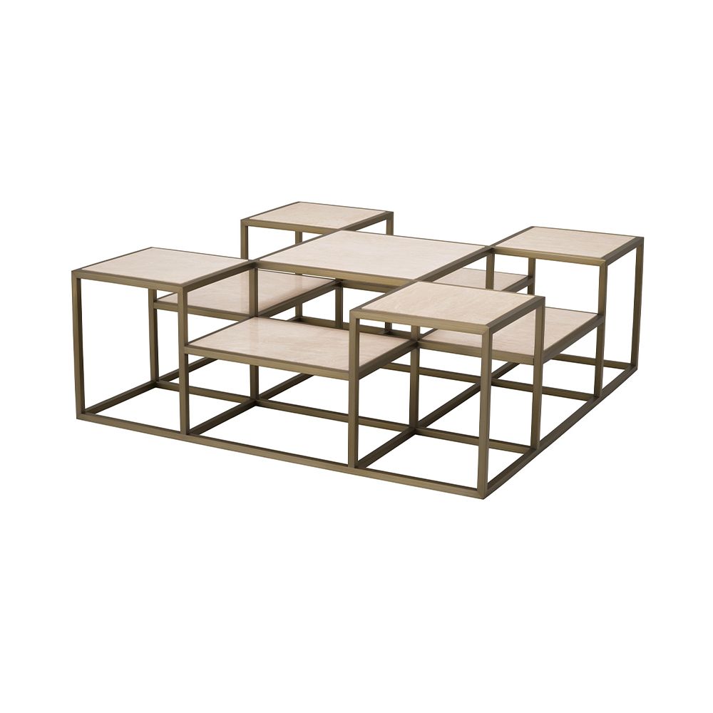 A contemporary coffee table by Eichholtz with a sculptural design featuring a brushed brass finish and travertine table tops