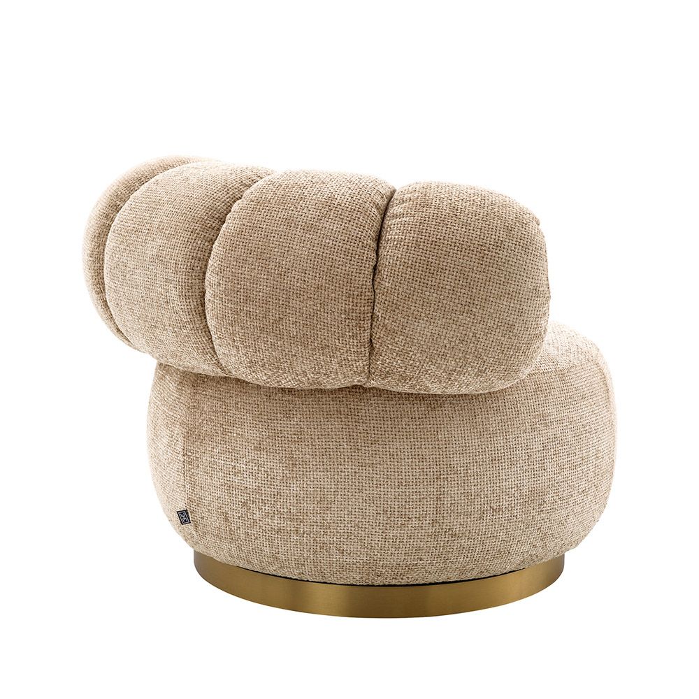 Dazzling swivel chair with brass base and sumptuous soft fabric
