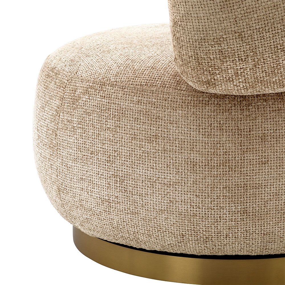 Dazzling swivel chair with brass base and sumptuous soft fabric