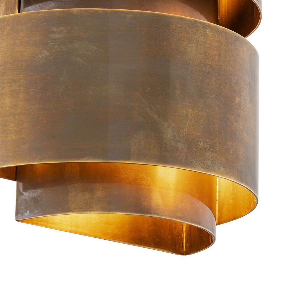 Stylish, modern brass wall light with vintage brass finish