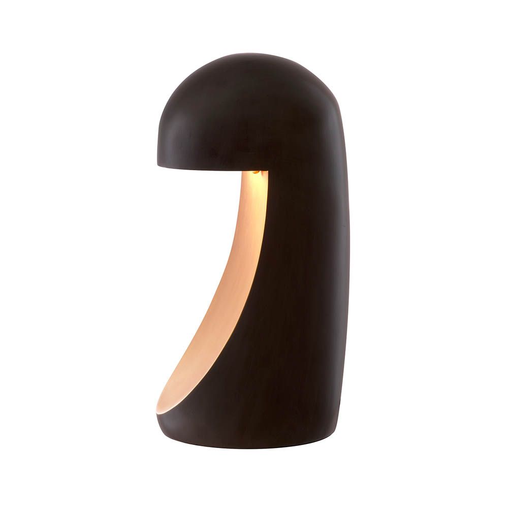 Strikingly modern table lamp with rounded black body and sweeping brass detail