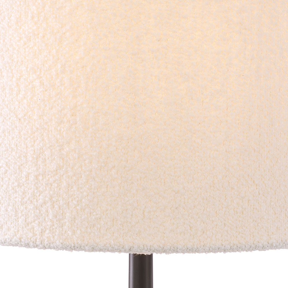 A luxury table lamp by Eichholtz carved from alabaster with an elongated boucle cylindrical shade