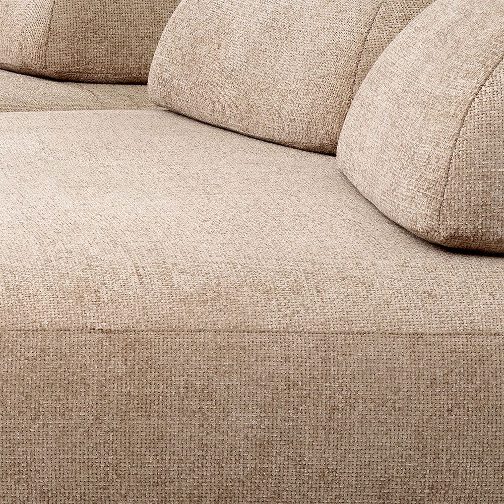 Luxuriously curvaceous sofa in soft lyssa sand upholstery