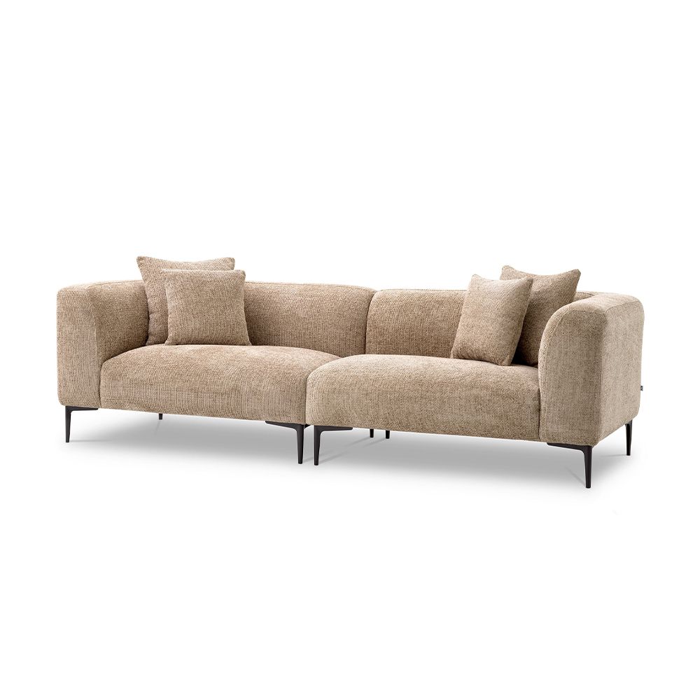 A luxury sofa by Eichholtz with a Lyssa sand upholstery and black legs