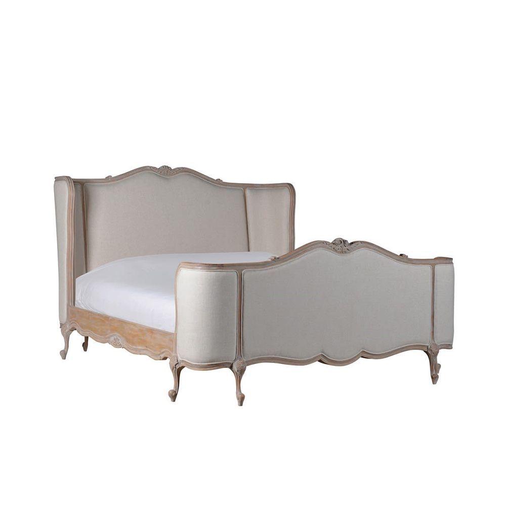 Classic french style bed with rustic wood finish and linen upholstery
