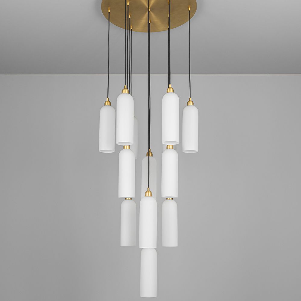 A luxurious chandelier by Schwung with translucent opal glass lampshades and a solid brass structure