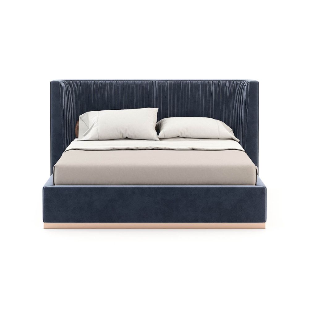 An elegant modern bed with vintage pleating and a copper plinth. Pictured in Vienna Deep Blue.