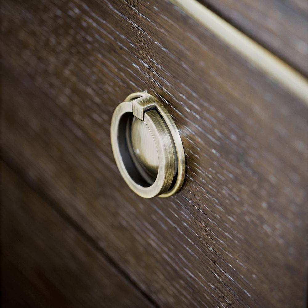A sophisticated dresser from Bernhardt with a burnished brass and white oak veneer finish, six legs and nine drawers