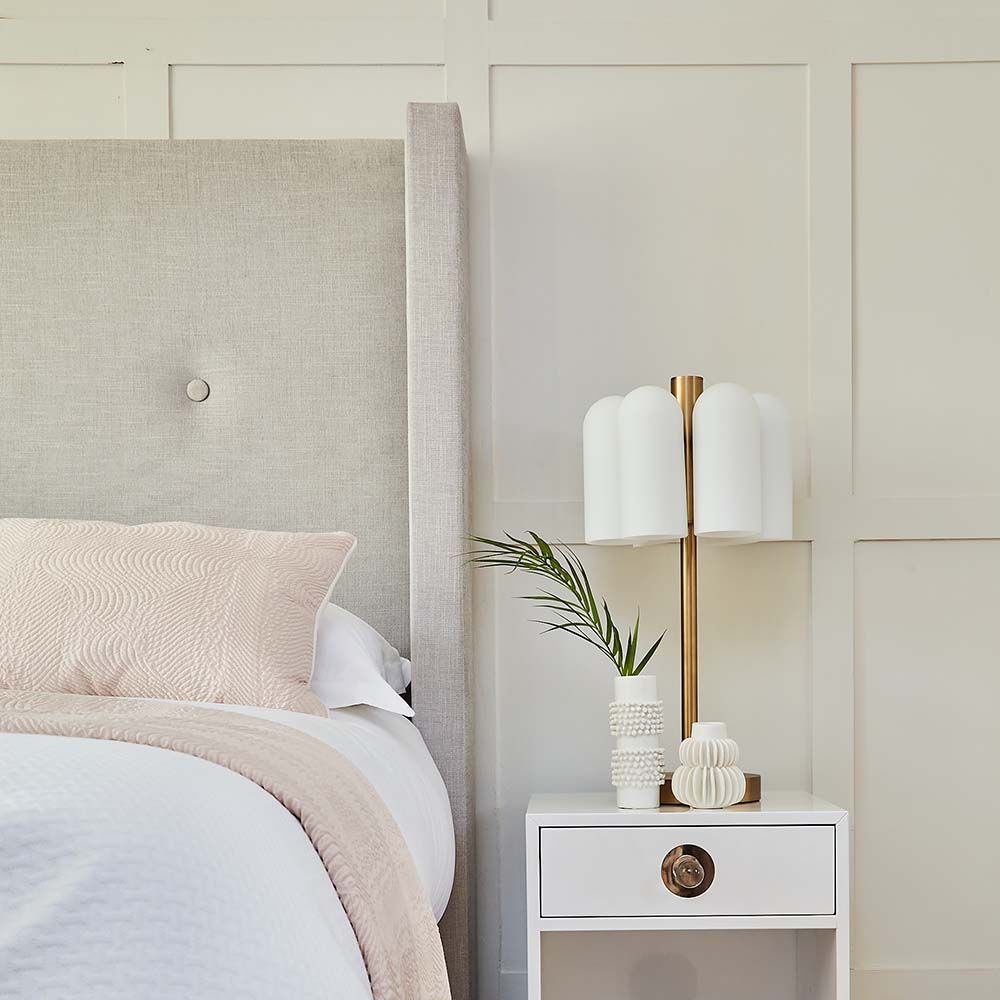 A luxurious minimal bed with deep-buttoning designed exclusively by Sweetpea & Willow