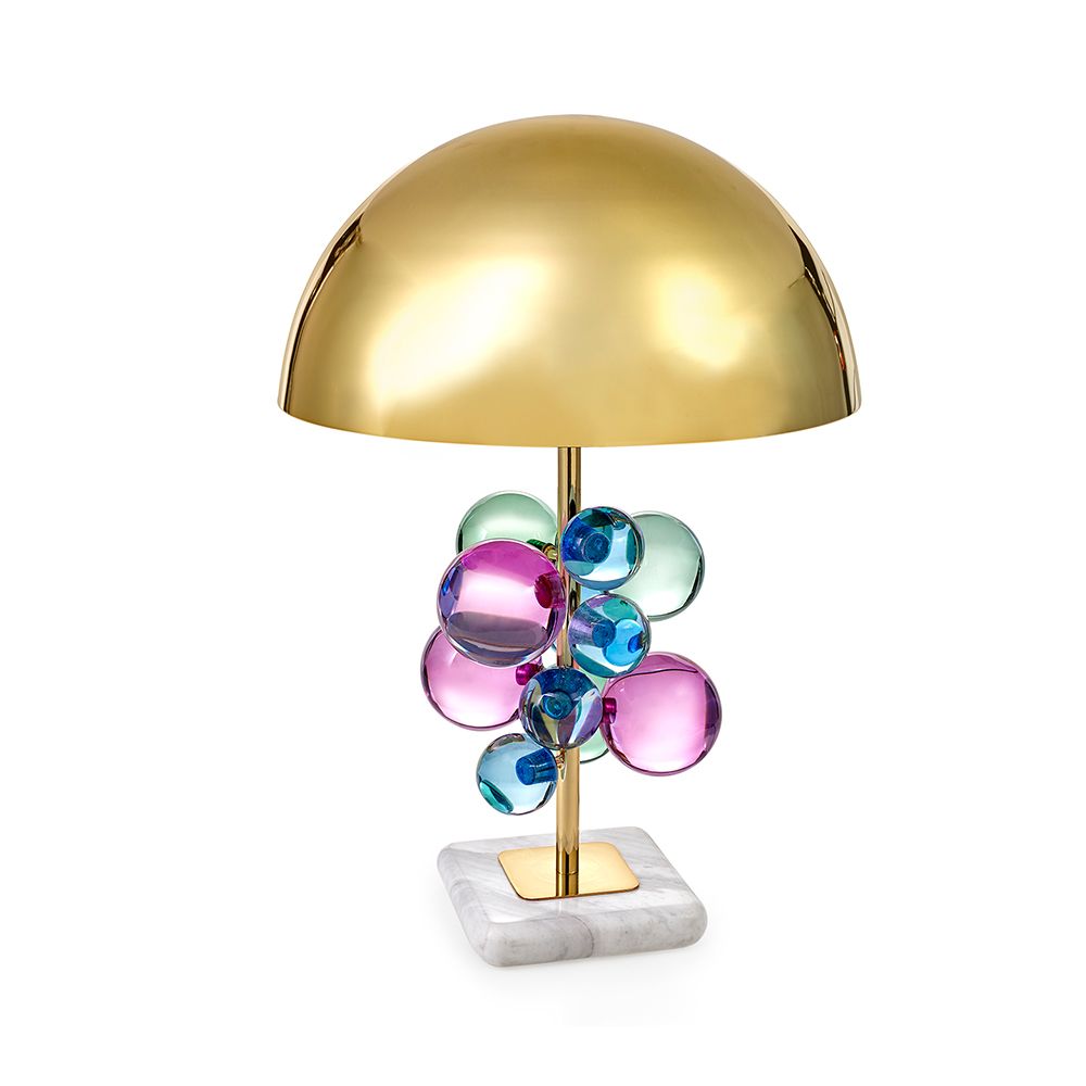 A polished brass table lamp with multicoloured acrylic globes and a marble base 