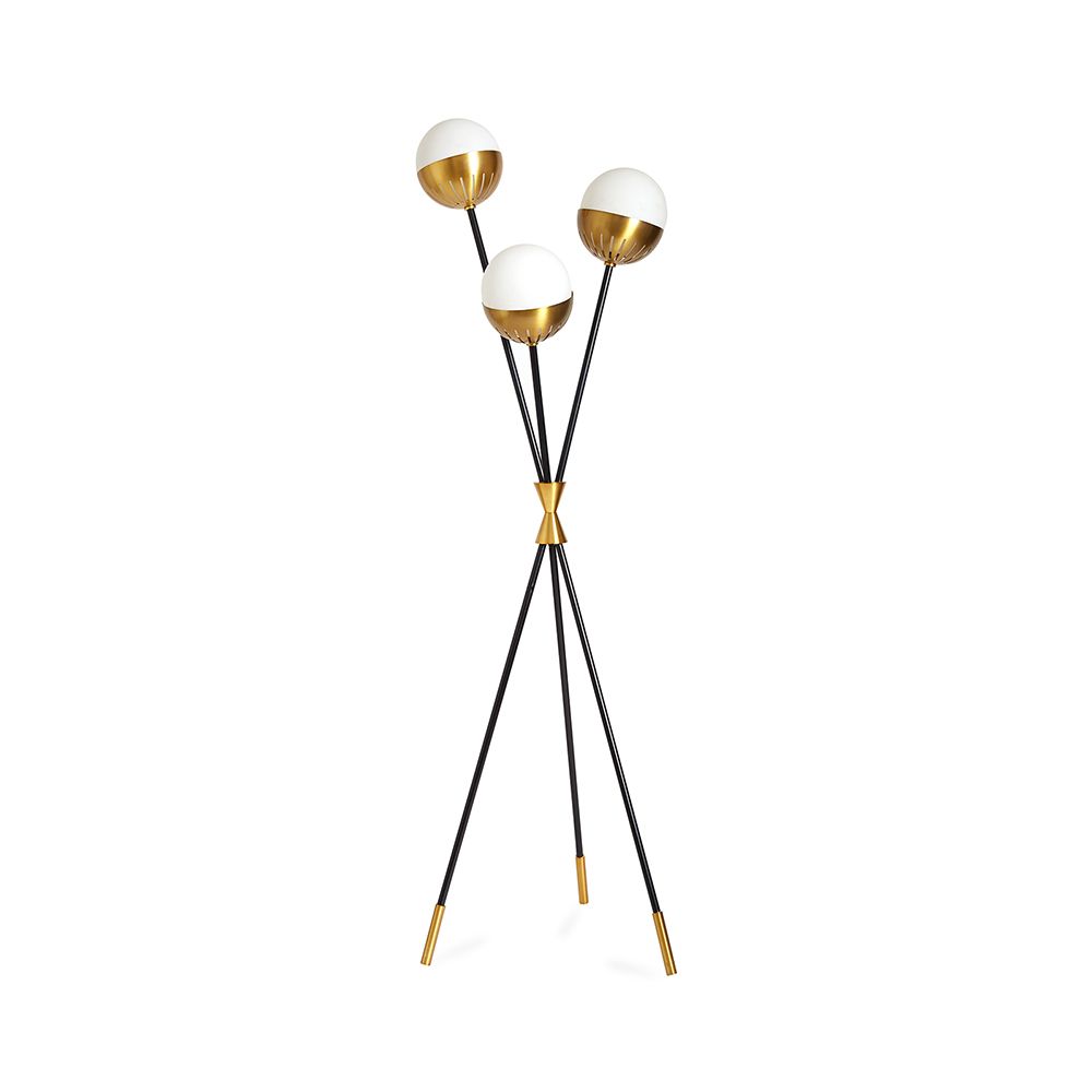 An elegant floor standing lamp with blackened metal stems and brass accents