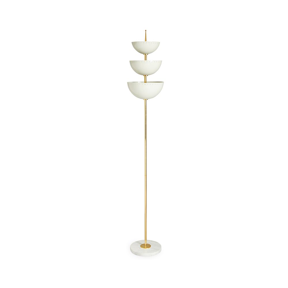 A luxurious floor standing lamp with ivory metal, polished brass and a marble base
