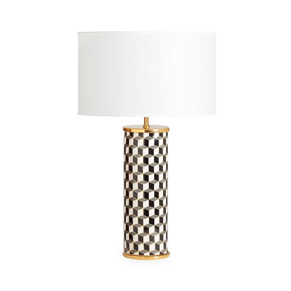 A stylish, porcelain table lamp with a chic geometric pattern and brass accents 