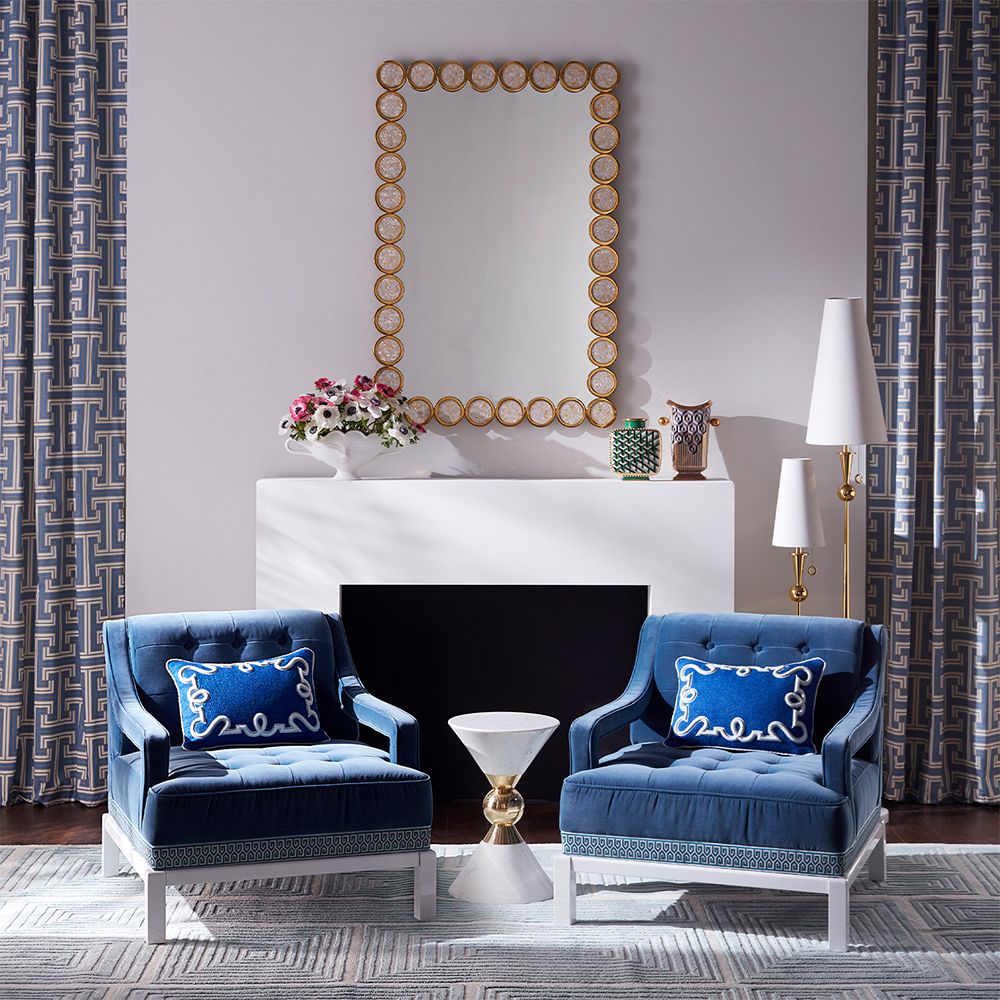 A luxurious, brass wall mirror with mother of pearl embellishments 