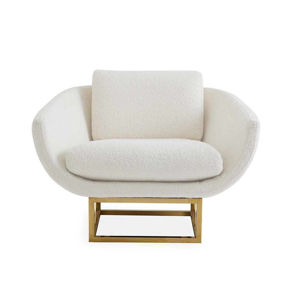 modern luxe armchair with ivory boucle upholstery and polished brass base