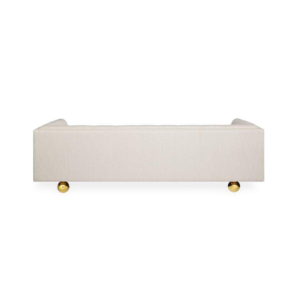 stylish, contemporary sofa with rounded feet and stone-coloured fabric 