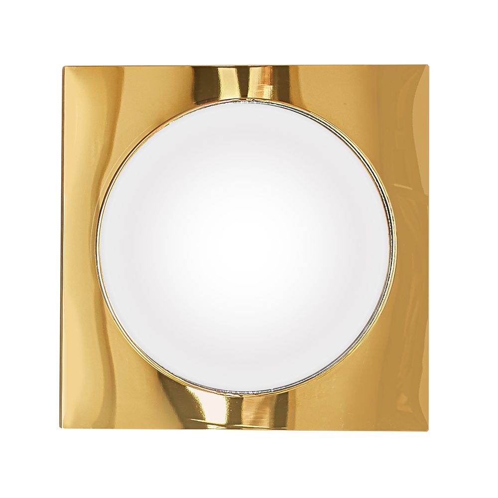 A polished brass mirror with a curved mirror