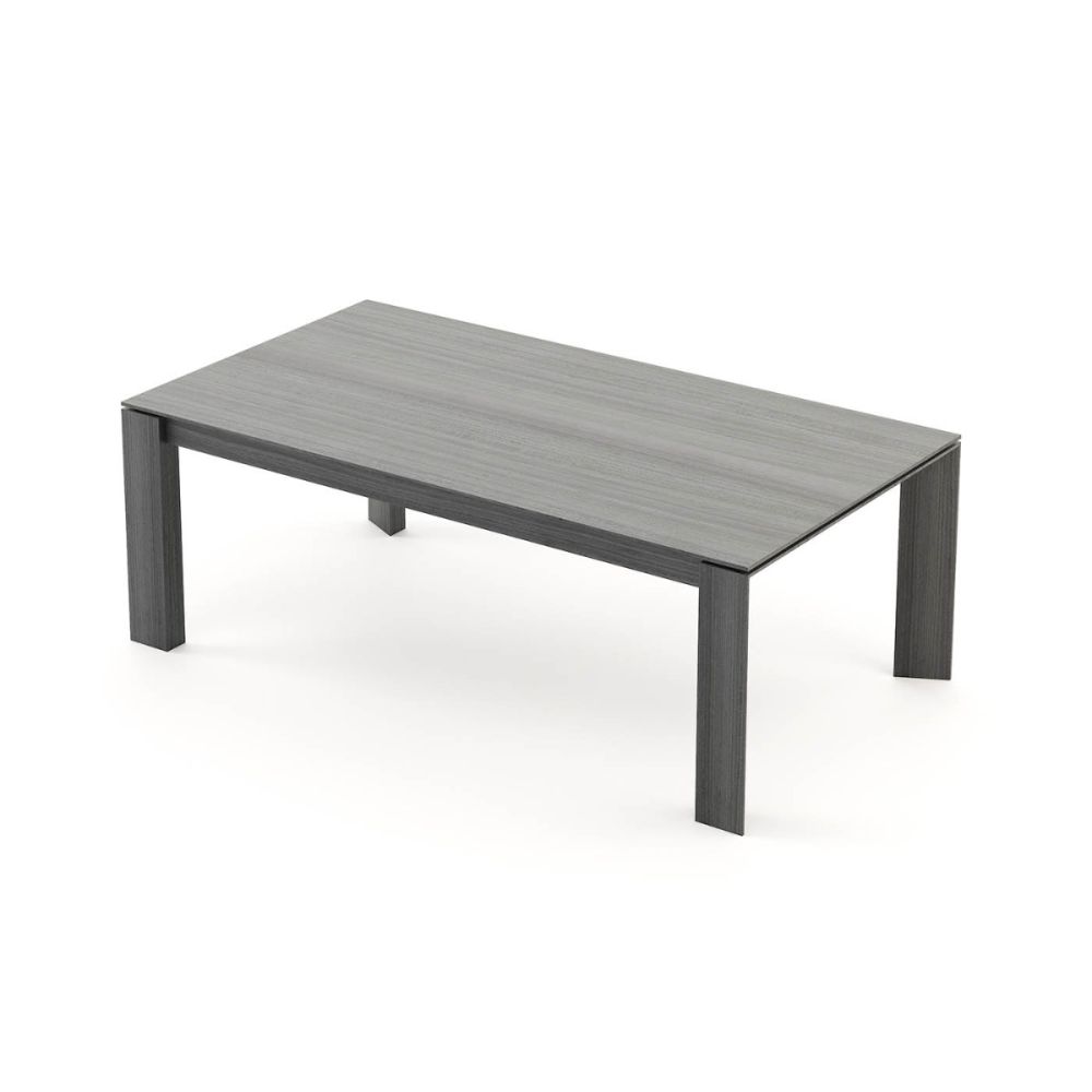 A luxurious, sculptural extendable dining table in a matte grey eucalyptus finish