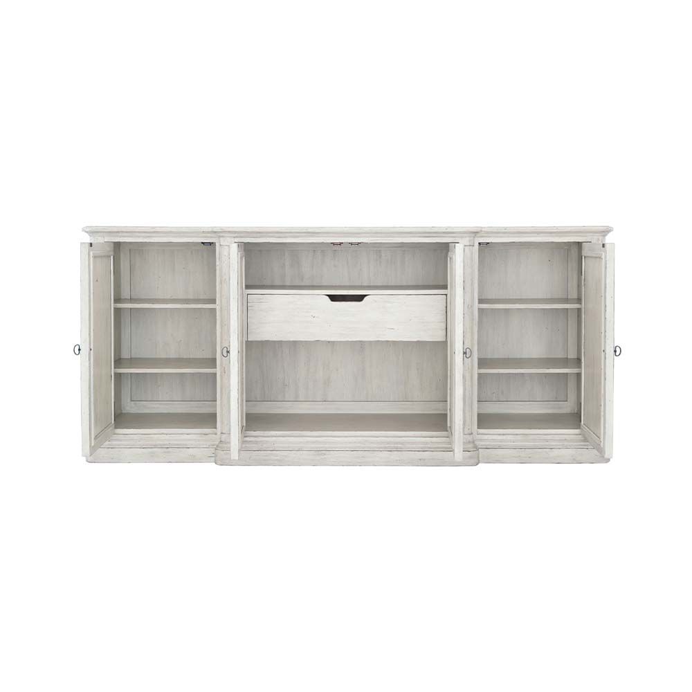 Elegant, distressed sideboard with decorated panel doors.
