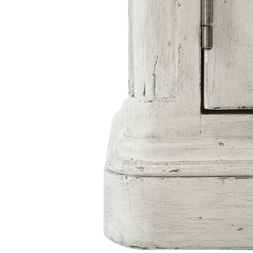 Elegant, distressed sideboard with decorated panel doors.