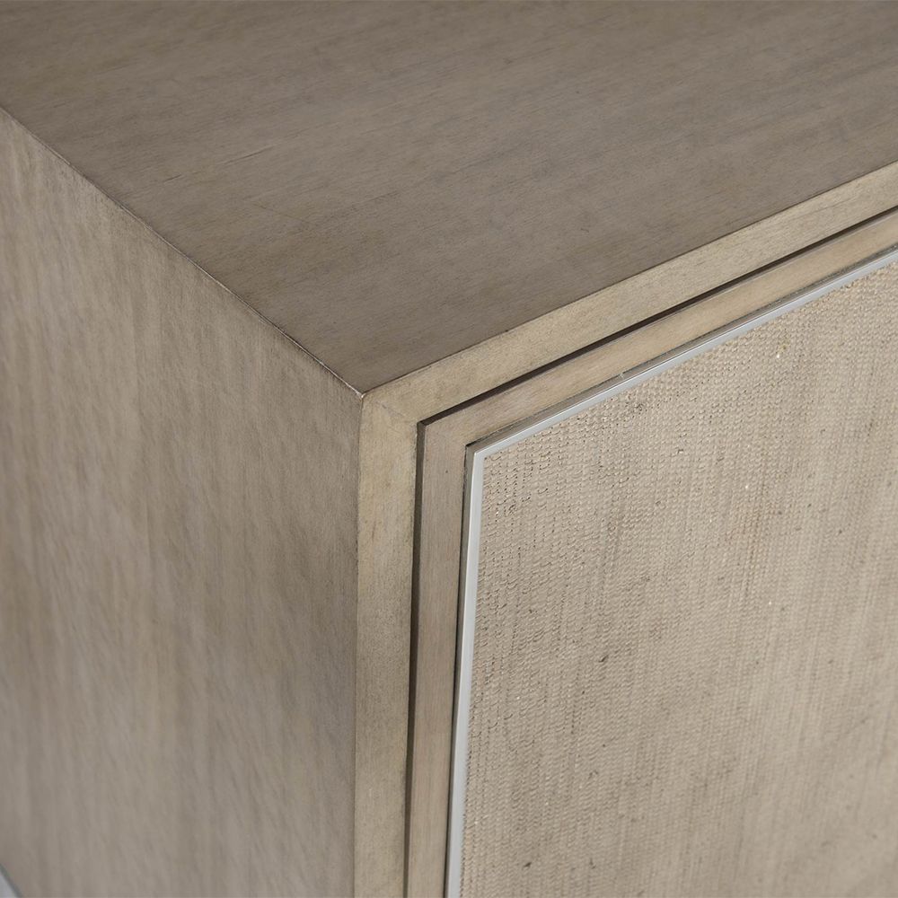 A gorgeous entertainment unit with four raffia panelled doors and finished with a polished stainless steel base and overlay 