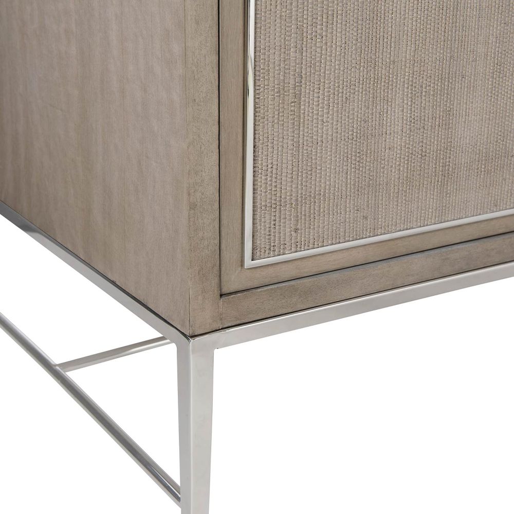 A gorgeous entertainment unit with four raffia panelled doors and finished with a polished stainless steel base and overlay 