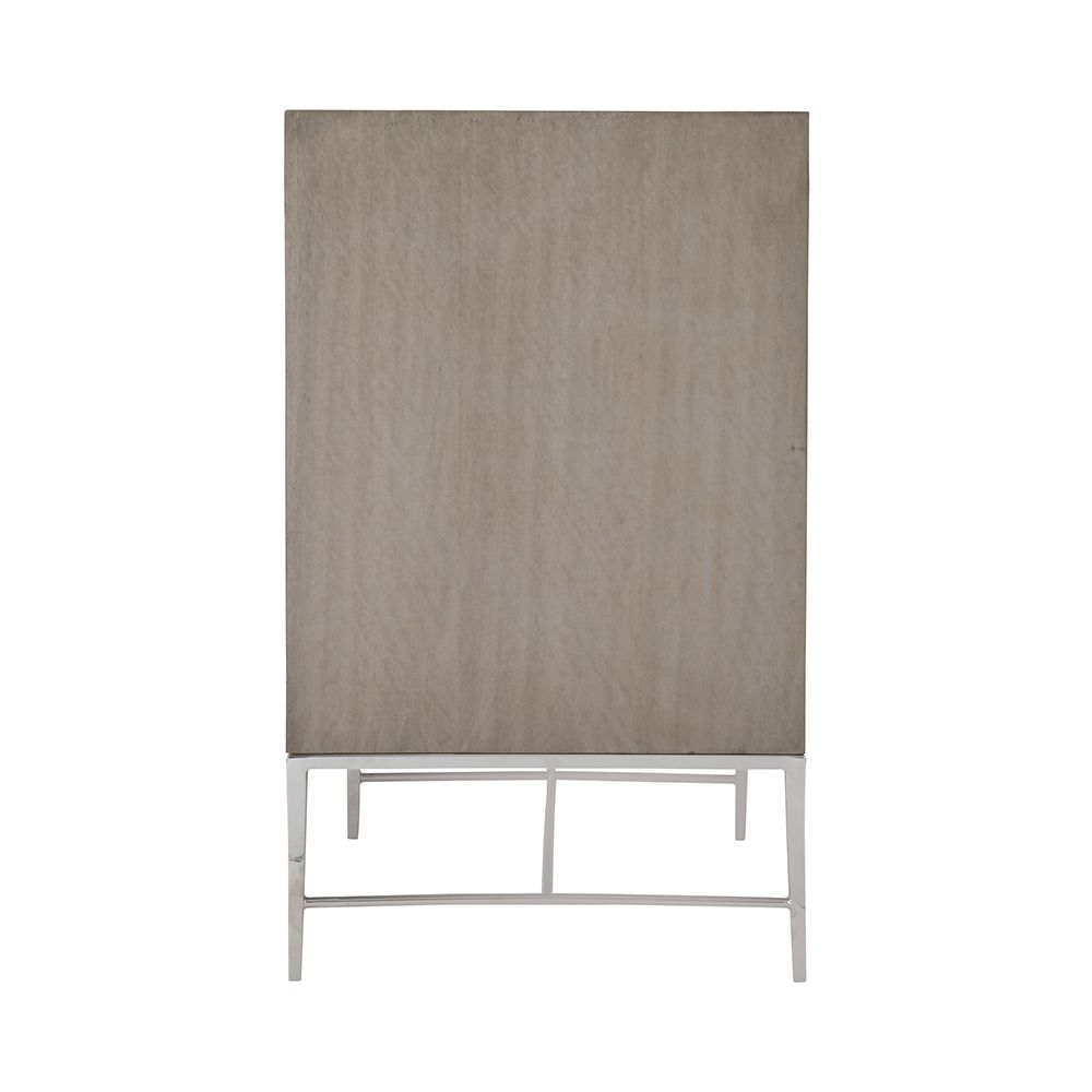 A gorgeous entertainment unit with four raffia panelled doors and finished with a polished stainless steel base and overlay 