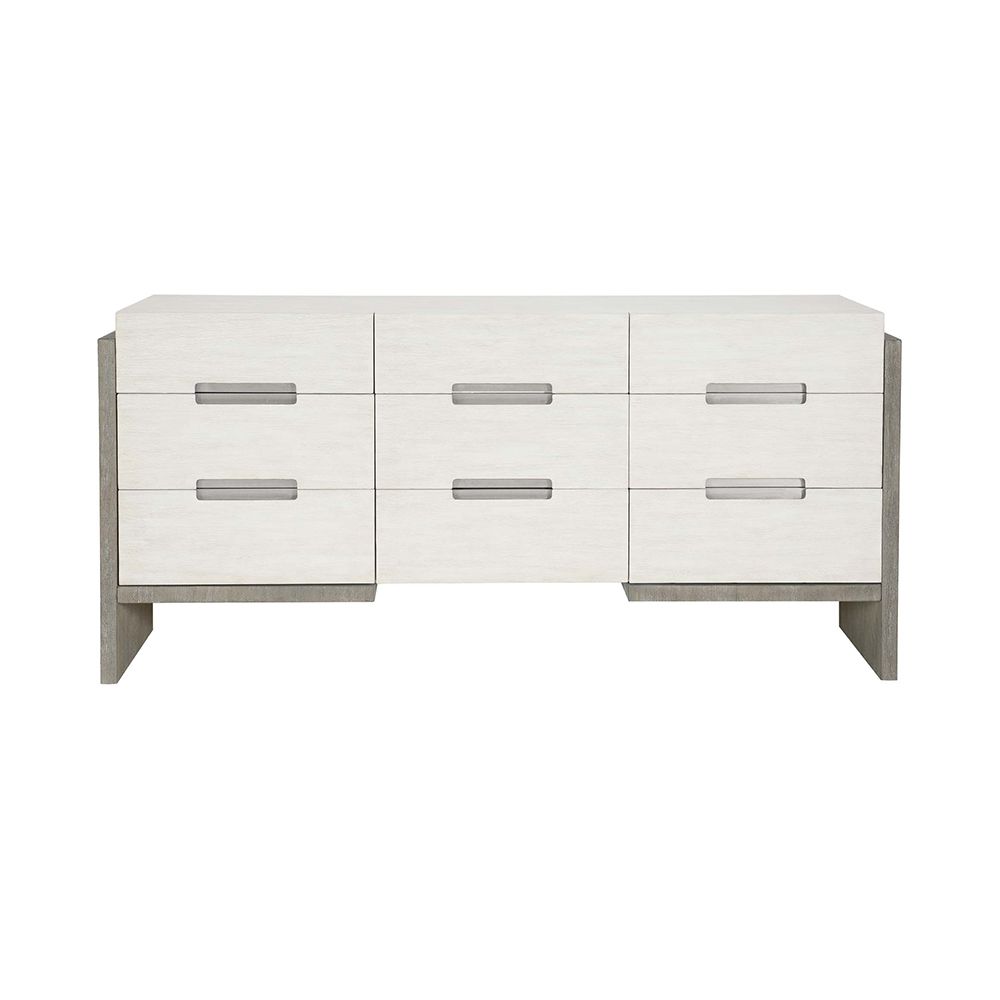 A sophisticated dresser from Bernhardt with a two toned white and grey finish, brushed stainless steel handles and nine soft closing drawers