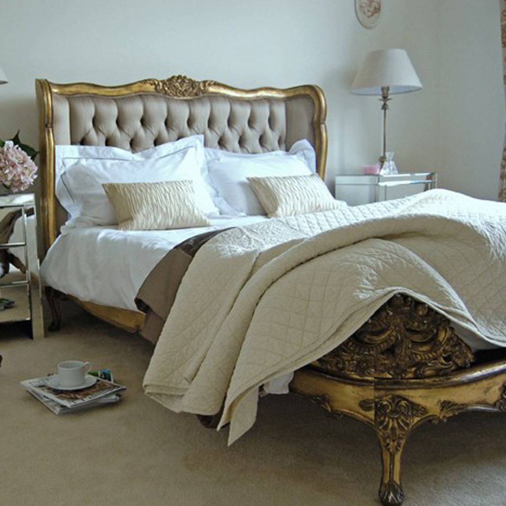 Gold gilt french bed with deep buttoned deep gold headboard
